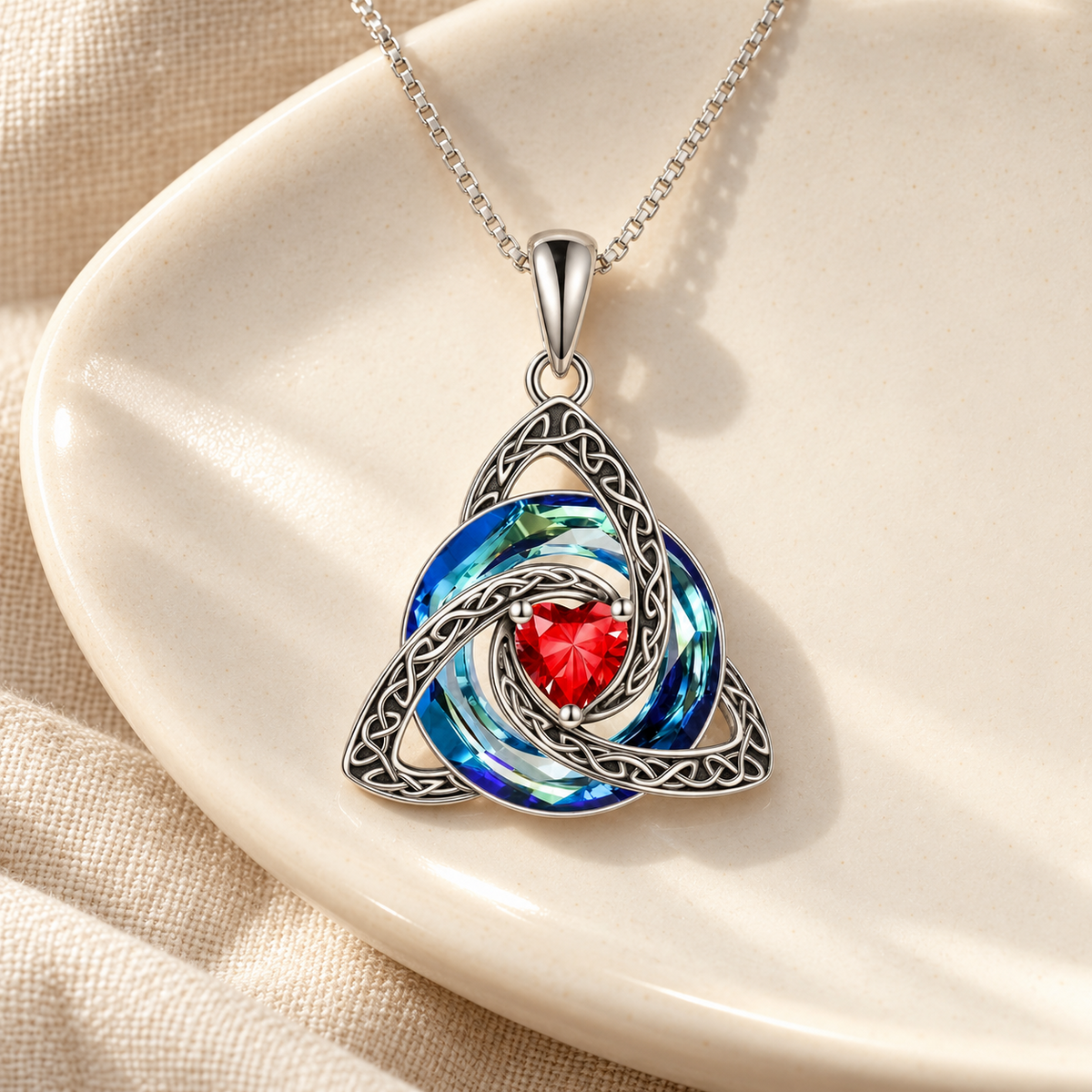 Mellowby editorial — Witch Knot Necklace with red heart on ivory ceramic